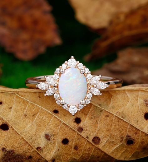 Engagement Ring Metal Type: 925 Sterling Silver, Soild 10k Gold, Solid 14k Gold, Solid 18k Gold Center Stone: Lab Created Opal Center Carat Weight: Oval Cut 1.5CT (6x8mm) Side Stone: Simulated Diamond / Moissanite Side Carat Weight: 0.44ctw Band Width: 2mm SKU: ESAMXR0005-opal Accessories: *Shipped with beautiful ring box; *Directly price from Manufacturer, 1/3 the price from Jewelry Store; - Ethically Sourced Wedding Rings With Opal, Opal Vintage Engagement Ring, Boho Wedding Ring Set, Plus Size Engagement Rings, Rings Engagement Opal, Opal And Diamond Engagement Rings, Opal Engagement Ring Silver, Wedding Rings Opal, Opal Accessories