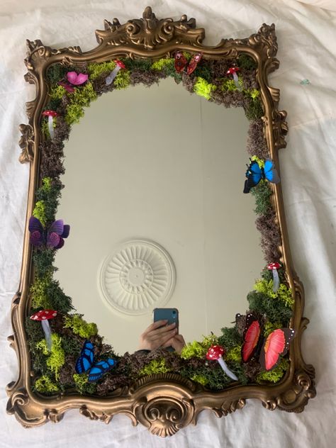 I made a moss mirror! Inspired by @nonbinaryfairie and @carolinequinner on TikTok Enchanted Forest Mirror Diy, Cute Mirror Frame Ideas, Mirror With Moss Frame, Moss And Crystal Mirror, Moss Art Mirror, Moss Framed Mirror, Moss Mirror Full Length, Fairy Garden Mirror Diy, Mirror Moss Art