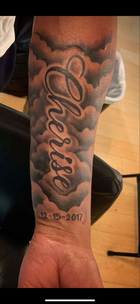 Name And Clouds Tattoo, Mens Cloud Tattoos, Forearm Tattoos Names Men, Name In Clouds Tattoo, Medium Men Tattoo Ideas, Clouds Around Name Tattoo, Last Name On Forearm Tattoo, Rip Tattoos For Men Forearm With Clouds, Rip Mom Tattoo For Men Forearm