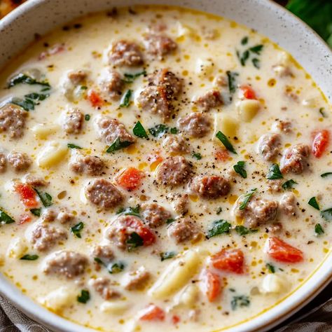 Indulge in this creamy, rich Parmesan Italian sausage soup with spinach. Perfect for any occasion. Easy to make in under 45 minutes! Creamy Parmesan Sausage Italian Soup, Italian Parmesan Soup, Slow Cooker Creamy Soup, Crockpot Sausage Soup, Italian Sausage Crockpot Recipes, Creamy Parmesan Italian Sausage Soup, Crockpot Cheeseburger Soup, Crockpot Cheeseburger, Cheeseburger Soup Crockpot