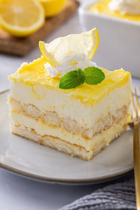 This Lemon Tiramisu is a citrusy, creamy, and delicious take on a classic Italian dessert. If you love classic tiramisu, you are going to love this recipe. Lemon Tirimasu Recipes, Lemon Teramasoo, Lemon Tiramisu With Lemon Curd, Lemon Christmas Dessert, Lemon Curd Recipe Desserts, Lemon Curd Pudding, Lemon Mascarpone Cake, Lemon Curd Dessert, Lemon Mousse Cake