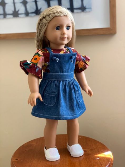 My daughter received an American Girl Doll for Christmas last year and I have been having so much fun sewing up little outfits for her. My five year old daughter loves being involved in the design process. We both agreed on a little denim pinafore dress and we love how it turned out. Best of all, I’ve provided the pattern as a free download plus a sew along tutorial for this post. Isn’t it cute? #doll #diy #dress #pinafore #free #tutorial American Girl Outfits, Clothes Makeover, Pinafore Dress Pattern, Dress Celebrity, Куклы American Girl, Doll Clothes Patterns Free, American Girl Doll Patterns, American Girl Doll Clothes Patterns, Dolls Clothes Diy