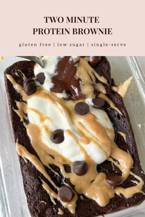 This healthy two minute protein brownie is gluten free, refined sugar free, low carb, low sugar, and high protein. On a small white plate is a single-serve protein brownie in the shape of a rectangle. The outside is a rich dark chocolate color looking soft, gooey in the center, pillowy, and fudgy. Some powdered monkfruit is white sprinkled on top. A fork has a bite on it showing the inside texture of soft, chewy, and airy. Favorite Healthy Snacks, Mint Chocolate Protein Powder Recipes, Tone It Up Protein Muffins, Desserts For Runners, High Protein Quick Dessert, Desserts With Chocolate Protein Powder, High Protein Meals Easy Fast, Gluten Free Protein Brownies, Gluten Free Protein Desserts