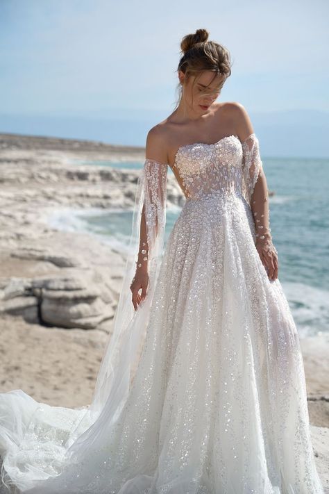 LPG Spring 2024 luxury bridal collection, “SUNRISE,” the Jewel gown, an elegant princess gown with a sweetheart corset. Embellished with sparkly sequins and 3D flowers. Features long detachable off-the-shoulder cape. #leegrebenau #luxuryweddingdress #luxurywedding #bridaldesigner #bridaltrends2023 #weddingdress #luxurywedding Lee Grebenau, Lee Petra Grebenau, Glitter Wedding Dress, Glam Bride, Sparkly Wedding Dress, Wedding Dress Sequin, Sparkly Wedding, Kleinfeld Bridal, Sequin Wedding