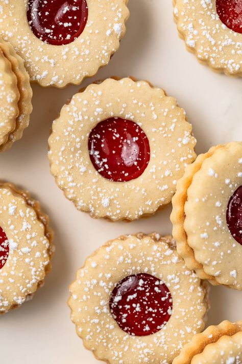 Strawberry Linzer Cookies are made with soft shortbread cookies sandwiched around sweet strawberry jam. They are great for Valentine’s Day, Mother’s Day, or Christmas. Strawberry Filling Cookies, Shortbread Cookie With Jam, Strawberry Linzer Cookies, Easy Linzer Cookies, Strawberry Filled Cookies, Dried Strawberry Cookies, Shortbread Cookies Aesthetic, Jam Sandwich Cookies, Homemade Christmas Sweets