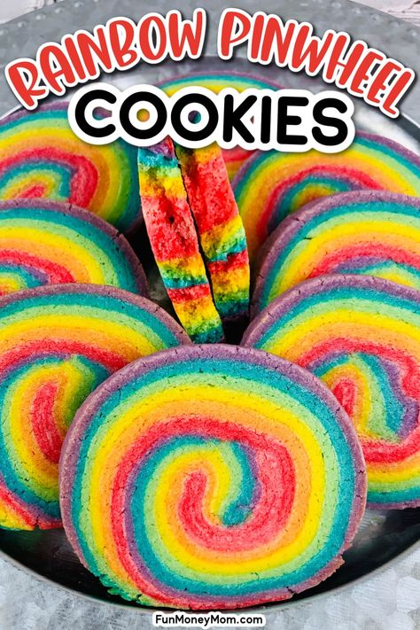 This Pinwheel Cookie Recipe is the perfect sweet treat for St. Patrick's Day, unicorn parties or just some rainy day fun! With beautiful, bright colors and a delicious sugar cookie taste, these rainbow cookies are as much fun to make as they are to eat! Fun Cookie Recipes For Kids, Pride Party Snacks, Colorful Snacks For Kids, Bakers Day Ideas For Kids School, Kid Baking Ideas, Rainbow Christmas Cookies, Rainbow Treats For Kids, Pride Dessert Ideas, Kids Cookies Recipes