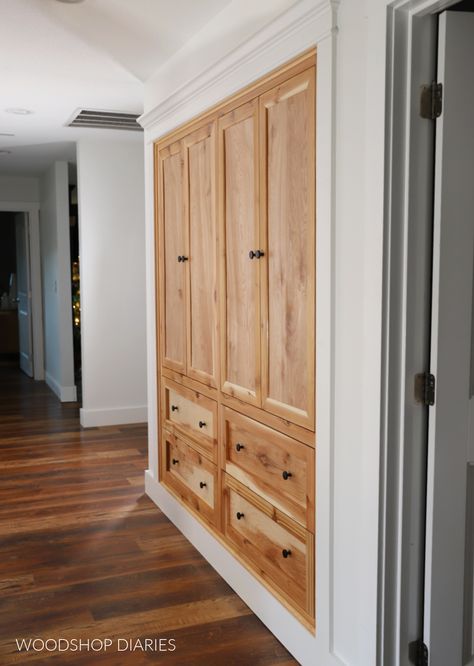 Learn how to turn a basic closet into custom built ins with this tutorial. Make your storage functional with hallway closet built ins. Built In For Closets, Built In Cabinet Closet, Hallway Laundry Closet Storage, Hall Built In Storage, Hallway Closet Ideas Storage, Custom Wall Closet Built Ins, Entryway Built In Ideas Storage Cabinets, Turn Closet Into Built In Pantry, Linen Closet Hallway Built In