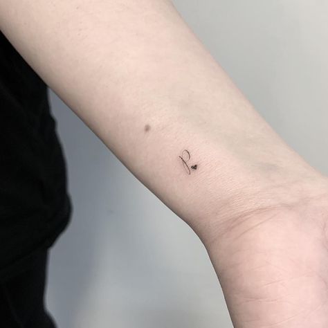 Tiny letter tattoo Tiny Letter Tattoo, Precious Tattoo, P Tattoo, Letter Tattoo, Small Couple Tattoos, Small Tattoos Simple, Initial Tattoo, Tattoo Videos, Dainty Tattoos