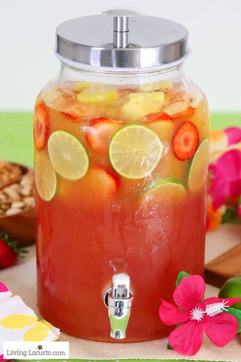 Tropical rum punch is a delicious summer cocktail recipe for a luau party or to sip by the pool! A pitcher drink mixture of juice and coconut rum for a pretty layered drink. Beach Punch, Tropical Rum Punch, Cocktail Punch, Pane Naan, Yummy Summer Cocktails, Pitcher Drinks, Rum Punch Recipes, Layered Drinks, Alcoholic Punch