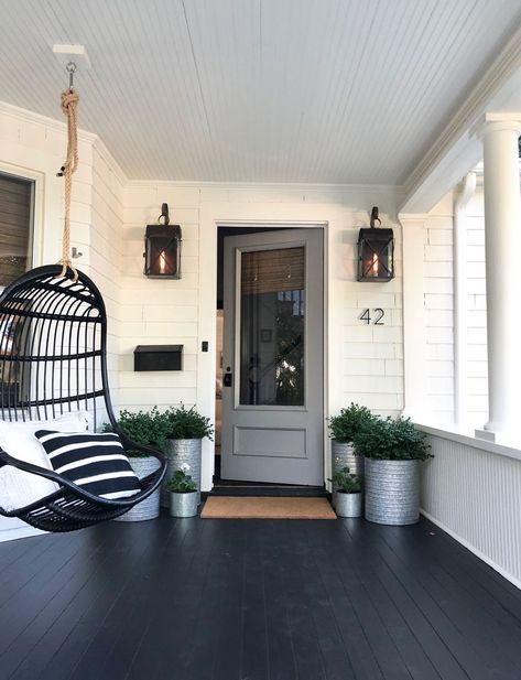 We painted our pink door gray! Come see what else we did for curb appeal. #mostlovelythings #graydoor #curbappeal #entryway #porch #hangingchair #planters #outdoorlighting #outdoorsconces Industrial Front Porch Ideas, Black Porch Ideas, Craftsman Front Porch Ideas, Rustic Farmhouse Front Porches, Craftsman Front Porch, Black Porch, Farmhouse Front Porch Decorating, Modern Front Porches, Breezeway Ideas