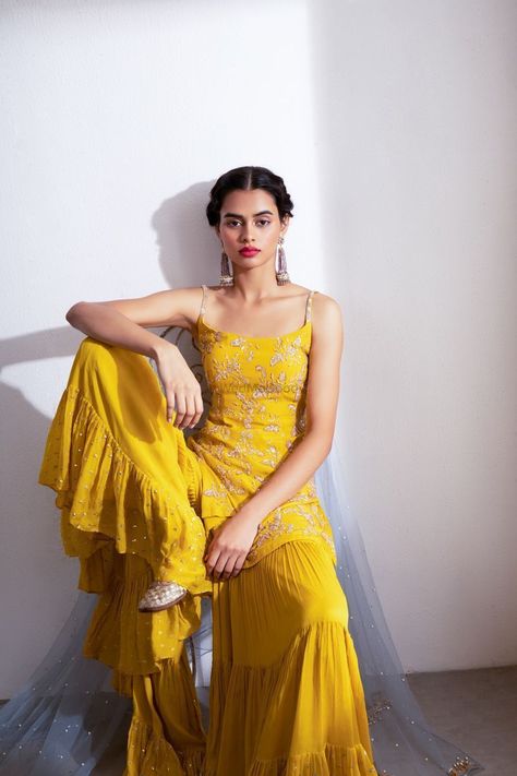 Where To Shop For The Perfect Mehendi Sharara & Gharara! *Bonus Lesser Known Gems Too! | WedMeGood Yellow Indian Outfit, Color Ocre, Sharara Designs, Haldi Outfits, Kurta Sharara Set, Haldi Outfit, Flared Palazzo, Mehendi Outfits, Kurta Sharara