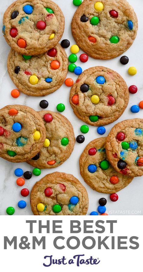 A top-down view of M&M cookies studded with a rainbow of M&M's. M&m Cookies Soft, M M Mini Cookies Recipe, Subway M&m Cookie Recipe, Soft Batch M&m Cookies, Mini Mnm Cookies Recipe, Homemade M&m Cookie Recipe, Homemade M M Cookies, Cookies Recipes M&m, Mrs Fields M&m Cookies