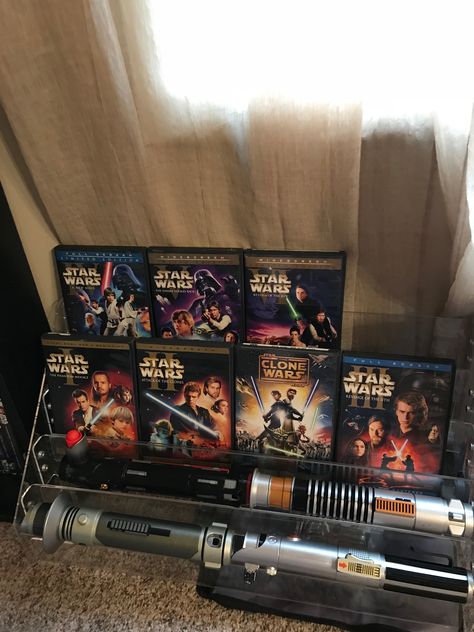 My new Star Wars lightsaber and DVD Display Star Wars Fan Aesthetic, Lightsaber Aesthetic, Movie Star Aesthetic, Dvd Display, Star Wars Collectibles, Star Wars Lightsaber, Star Wars Room, Star Wars Books, Star Wars Light Saber