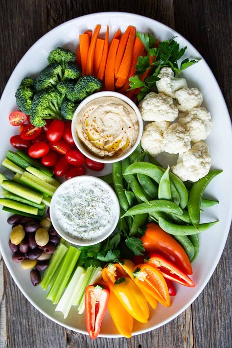 Learn how to make a crudités platter for the perfect party appetizer using a few simple tips. This French appetizer platter is packed with fresh vegetables and is sure to please the crowd! #HalfYourPlate #Crudite #Vegetables #VeggiesAndDip Veggie Tray For A Crowd, Veggie Plate Ideas, Easy Crudite Platter Ideas, Dip Platter Ideas, Vegetable Board Ideas, Easy Party Platters, Simple Veggie Tray, Vegetable Trays Ideas Parties, Party Food Presentation