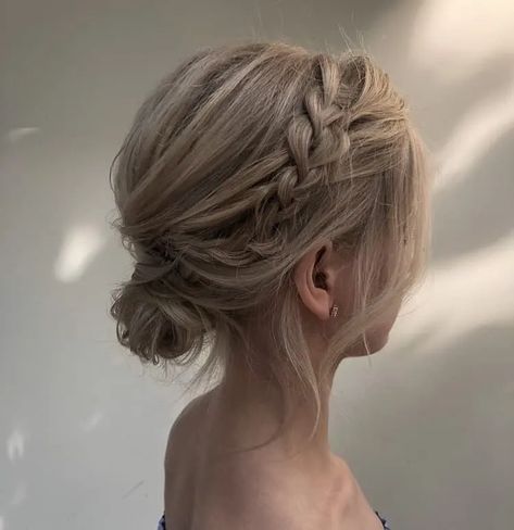 23 Easy Messy Bun Hairstyles You Can Try In Minutes Messy Low Side Bun Wedding, Low Bun With Braid Short Hair, Formal Low Bun For Short Hair, Bridal Low Bun Short Hair, Bridesmaid Side Bun Hairstyles, Low Bun With Fringe, Plat Bun Hairstyles, Low Messy Bun Formal, Tousled Low Bun Wedding