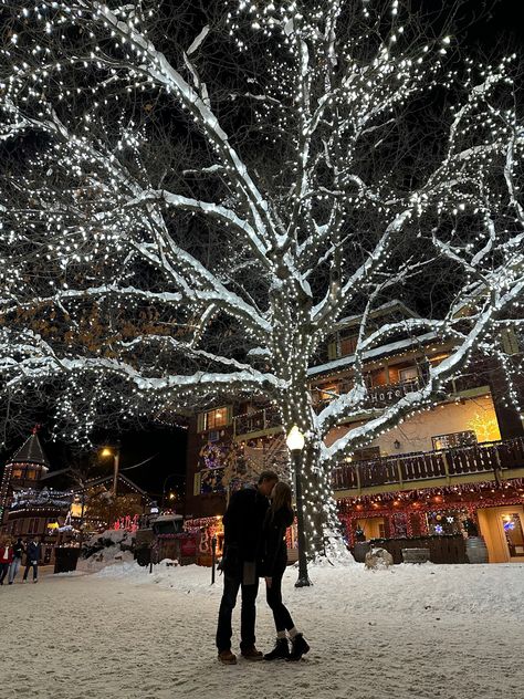 Christmas couple. Christmas tree. Christmas lights. Snow. Leavenworth. Christmas things. Travel. Holiday travel. Christmas town. Couple things. Kiss In Snow, Christmas Romcom Aesthetic, Romantic Christmas Aesthetic, Christmas Romance Aesthetic, Christmas Relationship Aesthetic, Christmas Lights Date, Kissing In The Snow, Christmas Couple Aesthetic, Looking At Christmas Lights