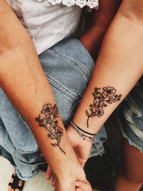 My mother/ daughter tattoo #flowertattoo #motherdaughter #flowers Mother Daughter Tattoos Country, Edgy Mother Daughter Tattoos, Mother And Multiple Daughter Tattoos, Mother Daughter Tattoos Floral, Mother Daughter Tattoos Meaningful For 3, Small Matching Tattoos Mom And Daughter Flower, Mother Daughter Tattoos Western, Dainty Matching Tattoos Mother Daughter, Matching Mother Daughter Tattoos Flowers