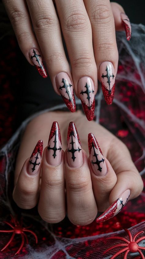 Embrace your dark side with these gothic-inspired stiletto nails! The nude base elegantly frames a striking black cross design that fans out, while vibrant red glitter at the tips adds a captivating touch. Set against a vampy red velvet backdrop with spider web accents, these nails are perfect for Halloween or any occasion when you want to make a bold statement!
#halloweennails #halloweenvibe #halloweeninspo #acrylicnails #nailsdesign #octobernails Dark Red Nails Halloween, Goth Stiletto Nails Designs, Gothic Christmas Nails Simple, Spiderweb Nails Coffin, Christmas Nail Ideas Stiletto, Spooky Holiday Nails, Ghost The Band Nails, Press On Nails Goth, Dark Romance Nails Ideas