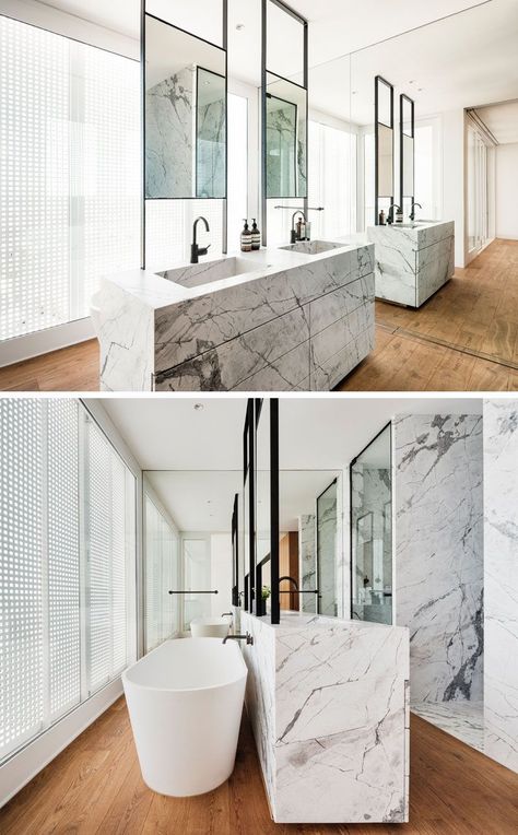 In this modern master bathroom, a double sink vanity is positioned in the center of the room, while a freestanding bathtub is located behind the vanity, and a full wall mirror makes the room feel twice as big. #ModernBathroom #BathroomDesign #EnsuiteBathroom Full Wall Mirror Bathroom, Luxury Bathroom Master Baths Beautiful, Madeleine Blanchfield, Bathroom Big, Luxury Bathroom Master Baths, White Wall Mirrors, Mirror Wall Living Room, Mirror Wall Bedroom, Big Bathroom