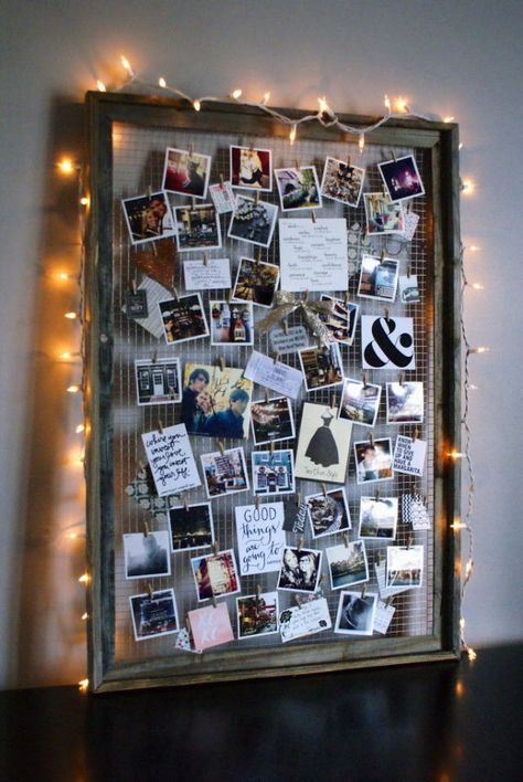 By removing the glass interior and adding wire, you can elevate an old frame into a beautifully crafted photo collage-esque display. Bonus: Add string lights around the frame to create a soft glow. Get the tutorial at Anastasia Co.   - CountryLiving.com Diy Mood Board, Photo Collage Diy, Diy Dorm Decor, Dorm Diy, Polaroid Wall, Old Picture Frames, Photo Board, Decoration Photo, Lodge Decor