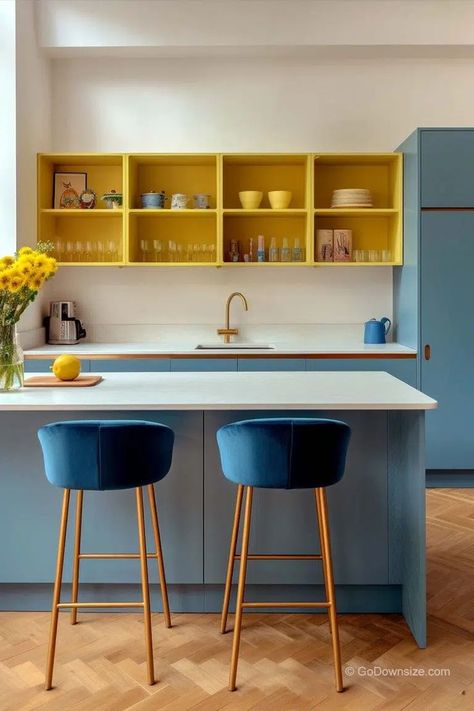 This modern vibrant kitchen can’t help but make you cheerful with its design. Yellow is complementary to blue, so it’s only natural that it works so well in this space Blue Yellow Kitchens, Kitchen Color Yellow, Blue Kitchen Designs, Vibrant Kitchen, Materials Board Interior Design, Kitchen Design Small Space, Beautiful Kitchen Designs, Accent Storage, Yellow Interior