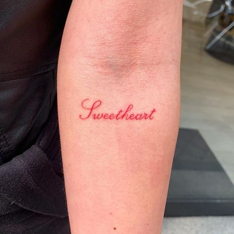 Red Ink Quote Tattoo, Old English Word Tattoo, Lover Word Tattoo, Lovely Tattoo Word, Red Cursive Tattoo, Pretty Tattoo Fonts, Lover Girl Tattoo, Cursive Writing Tattoos, Lover Tattoo Word