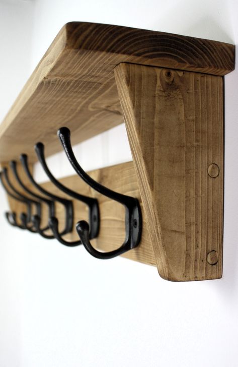 This wall mounted rustic coat rack with shelf and cast iron hooks that adds a little extra to a home. Made from solid wood and finished in a smoked oak shade, it looks great, rustic and traditional. The mounting holes are situated behind the end hooks so no screws are on show and fittings and instructions are provided. The dimensions are (depth) 12cm, (height) 18cm, length is dependent on size you choose. Dimensions, Length. 51cm coat rack (3 hooks) 63cm coat rack (4 hooks) 75cm coat rack (5 hoo Live Edge Coat Rack With Shelf, Oak Coat Rack, Hallway Coat Hanging Ideas, Hallway Hanger Ideas, Coat Hanging Ideas, Hallway Coat And Shoe Storage, Coat Hanger Ideas Front Entry, Coat Hook Ideas, Coat Hanger Ideas