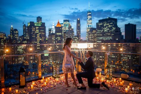 Glowing candles and flower petals on a rooftop in front of the New York City skyline Rooftop Proposal Decorations, New York City Proposal, Skyline Proposal, Candlelit Proposal, Candlelight Proposal, Gf Proposal, Ash Fox, New York Proposal, Destination Proposal