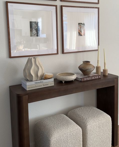 Looking to elevate your hallway or entryway? 🤎⁠ .⁠ Meet the Contour Console Table in Walnut—your go-to for a chic, modern touch. Its minimalist design seamlessly blends with any decor, while offering a stylish platform to showcase your favorite decor. Create a cozy, curated look and elevate your home’s vibe. Click the link in our bio to explore our full range of solid wood console tables!⁠ ⁠ #plankandbeam #console #minimalistaesthetic #quietluxury #hallwaydecor #homedetails #cozylivingroom Console Table Set Up, Entryway Table Apartment, How To Style Hallways, Bench Entrance Ideas, Walnut Wood Decor, Modern House Decor Ideas Apartments, Living Room Decor Townhouse, Home Decor Ideas Dark Wood, Entryway Decor Console Tables