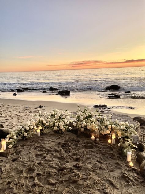 beach proposal, flowers on beach, beach engagement, beach proposal  ideas, beach proposal set up, beach sunset, coastal wedding, beach wedding, roses on beach, Proposal Sunset Ideas, Proposal With Flowers And Candles, Beach Proposal Black Couple, Married On The Beach, Beach Flower Proposal, Rose Beach Proposal, Proposal Ideas California, Cottagecore Beach Wedding, Flowers In Sand Proposal