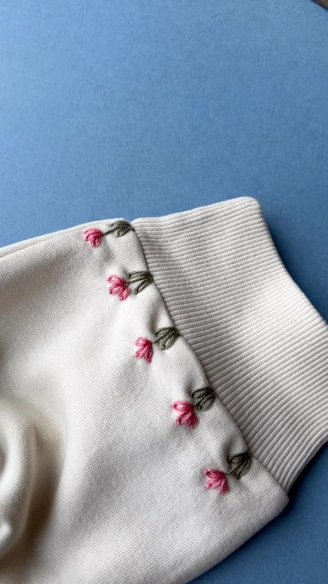 Spring Blooms 🌷 . . #sustainableclothing #handmadestyle #embroideryinstaguild #dmcembroidery #sewing #embroideryart #embroideryhoop… | Instagram Embroidery Simple Design Flower, Patterns For Embroidery Ideas, Trendy Hand Embroidery Designs, Simple Diy Embroidery Designs, Simple Embroidery On Sweatshirt, Embroidery Inspiration On Clothes, Simple Embroidered Designs, Easy Embroidery Sweatshirt, Pink Sewing Projects