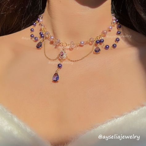 Fanciful Fairycore Jewelry 🧚 on Instagram: "Jennette Necklace 💜✨👑

A magical blend of royal purples and lavenders. Big thanks to @rana_simp4kaeya for the name idea (I know you love purple!) and a magical shoutout to @dressinguprocks for helping create this beauty! 💜

.
.
.
.
#fairycoreaesthetic #fairycorefashion #fairycorejewelry #fairyaesthetic #fairymagic #fairyvibes #dreamyvibes #fairyforest #fairycosplay #fairytalefashion #cottagecoreaesthetics #cottagecorejewelry #beadedjewelry #cottagecorefashion #oldmoney #bridgerton #bridgertonvibe #bridgertonjewelry #gemstonenecklaces #magicjewelry #sparklejewelry #magicaljewelry #crystalnecklace #aestheticlover #fairycorenecklace #beadednecklaces #angelcoreaesthetic #princessvibes #necklaceaddict #fairystyle" Bridgerton Jewelry, Coquette Necklace, Fairycore Princess, Cottage Core Jewelry, Jewelry Coquette, Witch Vibes, Fairy Jewelry, Magical Jewelry, Purple Necklace