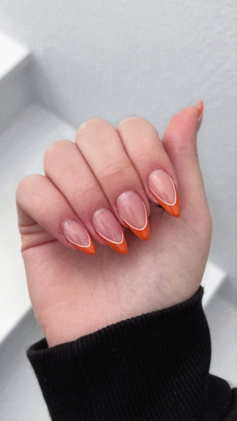 Trending Orange Nails, White And Orange French Nails, Orange And White Almond Nails, White French Tip With Orange Line, Orange Wedding Nails For Bride, Orange And White Halloween Nails, Burnt Orange And White Nails, Pumpkin Tip Nails, Light Orange French Tip Nails