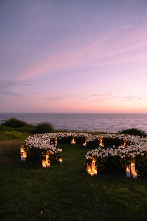 On the dreamiest summer evening in Malibu, set against the backdrop of the most perfect sunset, the Santa Monica Mountains, and the glistening Pacific Ocean, the newly engaged couple said ‘Yes’ to forever in one of the most romantic surprise proposals I have yet to witness (and photograph). Proposal Photography, Beach Proposal, Luxury Proposal, Malibu Proposal Disney Themed Proposal Ideas, Wedding Venues Sunset, Intimate Wedding Proposals, Wedding On A Cliff, Floral Proposal Set Up, Simple Elegant Proposal Ideas, Sunset Mountain Wedding, Scenic Proposal Ideas, Winter Mountain Proposal