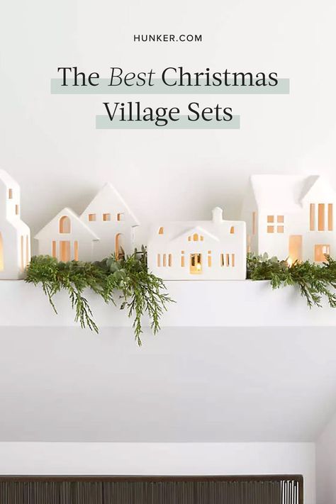 Whether you're looking for village pieces or unique additions to your current collection, here's a list of some of our favorite Christmas village sets. #hunkerhome #christmasvillage #christmasdecor #christmasdecorideas #holidaydecor Christmas Houses Village Display White, Diy White Houses Christmas, Christmas White Village Display, Christmas White House Village, All White Christmas Village Display, All White Christmas Village, White House Christmas Village, Christmas Village Garland, White Village Christmas Houses Mantle