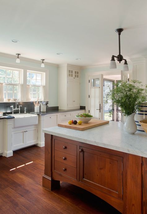 Cottage kitchen with large cherry island topped with a carrara marble illuminated by a bronze two arm pendant light with frosted glass shades. Kitchen Island With Sink, Best Kitchen Cabinets, Farmhouse Kitchen Island, House Of Turquoise, Cherry Cabinets, New Kitchen Cabinets, Kitchen Marble, Black Granite, Kitchen Paint