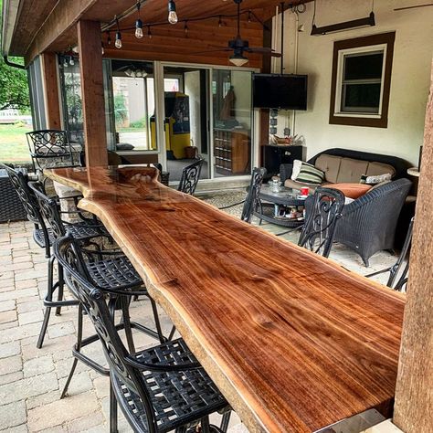 Outdoor Bar Tops Ideas, Live Edge Outdoor Bar Top, Back Porch Bar Table, Bar On Porch, Bar On Deck Ideas, Live Edge Bar Top With Epoxy, Patio Railing Bar Top, Under Deck Bar, Wooden Bar Top