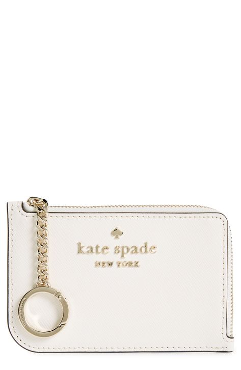 With just enough space for card and coin, this slender zip case is an everyday essential for traveling light. 3.25" x 5" x 0.25" Zip around closure Leather Imported Kate Spade Keychain Wallet, Cute Card Holder Wallet, Designer Keychain Wallet, Katespade Card Holder, Cute Wallet Keychain, Wallet With Keychain, Cute Car Stuff, Keychain With Wallet, Car Keychain Aesthetic