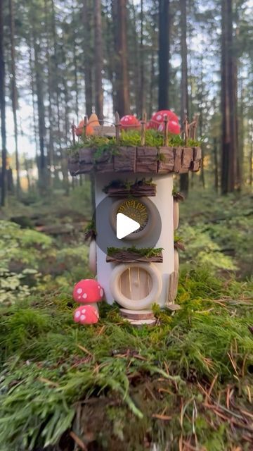 Maryinthefairyland on Instagram: "How about a fairy house with a solar roof?  For those eager to embark on a creative journey, I am considering creating a DIY kit with all the essentials. Please let me know if you are interested, so I can gauge the demand and determine how many kits to produce. Thank you for expressing your interest by subscribing here: https://t.ly/hjFuD  Materials used: clay, recycled jar, wood rings, wood cutouts, solar jar light, wood dowel, bark, twig, moss, hemp string, school- and hot glue. All the products used are conveniently showcased on my Amazon storefront. Find the link in my BIO for more details.  It’s important to note that the fairy house is a temporary installation, and I don’t leave them permanently in place.  #fairyland #fairyvillage #fairyforest #whims Temporary Installation, Recycled Jars, Fairy Village, Fairy Jars, Solar Roof, Clay Houses, Jar Lights, Amazon Storefront, Wood Rings