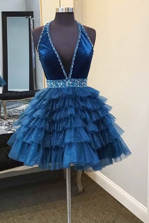 Turn heads at your homecoming with the Blue Halter Multi-Layered Tulle Homecoming Dress. This stunning A-line dress is crafted from delicate tulle fabric with a sophisticated halter neckline and sleeveless design, ensuring you look elegant yet comfortable. The ruffled embellishments of the layers of tulle add a touch of playfulness and drama, making every twirl enchanting. Details: Silhouette: A-Line Style Fabric: Tulle Fabric Color: Navy Blue, Red Color Length: Short Length Neckline: Halter Nec Blue Dresses Short, Teal Homecoming Dresses, Navy Homecoming Dress, Short Red Prom Dresses, Ruffle Beading, Tulle Homecoming Dress, Marine Uniform, Prom Dresses Two Piece, Short Homecoming Dress