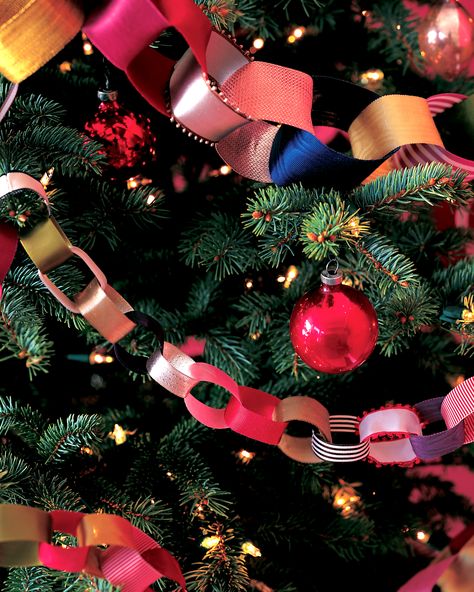 DIY Christmas Tree Garland Ideas to Personalize Your Holiday | Sorry tinsel, your time is over. These festive embellishments are the perfect garland to adorn your Christmas tree. Here's a cost-effective recyclable option: use paper ribbons from gifts to craft this decorative chain-and keep adding for years to come!  #christmas #crafts #marthastewart #DIYdecor Christmas Tree Ribbon Garland, Christmas Tree Garland Ideas, Diy Christmas Tree Garland, Tree Garland Ideas, Garlands Christmas, Diy Garlands, Diy Christmas Garland, Garland Ideas, Christmas Garlands