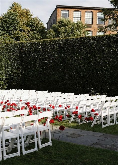 Imagine being led down the aisle by these exquisite red roses surrounded by a picturesque garden setting at this outdoor wedding ceremony. Walking down the aisle accompanied by a live harpist is so elegant. #outdoorweddingceremony #outdoorwedding #weddingceremony #redroses #harpist #weddingmusic #overthemoon #townandcountrymag #theknot #weddingplanner #nycweddingplanner #luxuryweddings #alinatoevents Wedding Aisle Red, Picturesque Garden, Wedding Aisle Outdoor, White Wedding Ceremony, Red Wedding Decorations, Wedding Isles, Red And White Weddings, Rose Petals Wedding, Ceremony Chairs