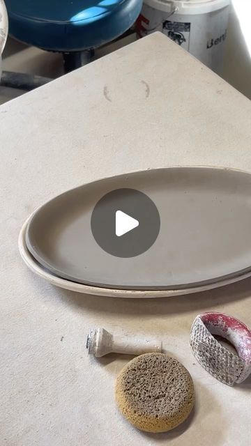 Joyful Clay, Sarah Sewell-Tippin on Instagram: "Making a platter part 2.  . . . #handmade #handbuiltpottery #handbuilding #ceramics #pottery #joyfulclay #marylandmade #annapolismd #wednesdayvibes #kitchenessentials #etsyfinds #giftideas #potterylove #claylove #potterslife #productionpottery #lovemyjob #maker #makersgonnamake #makearteveryday #makeart #artist #potteryvideo #pottersofinstagram" Ceramic Cake Plate Stand, Handbuilt Ceramic Plates, Clay Ideas Tutorials, Slab Plates Ceramics, Clay Kitchen Decor, Pottery Platters, Pottery Slab Ideas, Handmade Ceramic Plates, Pottery Plates Handmade