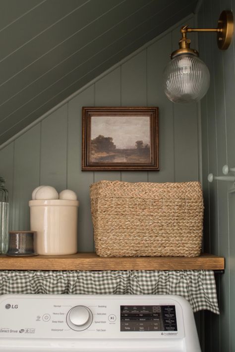 Laundry room transformation from boring and beige to moody and beautiful. Colonial Style Laundry Room, Laundry Room Wall Organization Ideas, Laundry Closet Farmhouse, Folding Table Above Washer And Dryer, Light Yellow Laundry Room, Shelf Under Cabinet Laundry Room, Laundry Room Design Mid Century Modern, Laundry Room Crafts, Laundry Curtain Hide