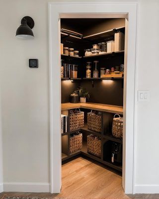 Pantry With Black Walls, Black Cabinet Pantry, Black And Gold Pantry Organization, Pantry With Black Cabinets, Urbane Bronze Pantry, Black And Wood Pantry, Pantry Paint Ideas, Pantry Lighting Ideas, Moody Pantry