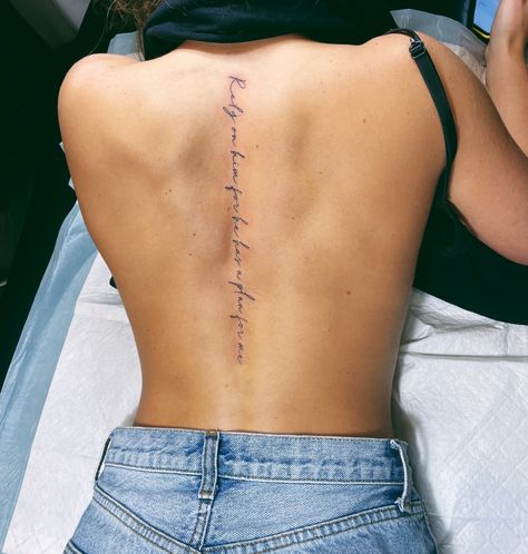 Text Spine Tattoo, Lady Spine Tattoo, Fine Line Tattoo Down Spine, Quote Tattoo On Spine, Cursive Down Spine Tattoo, Proverbs 31 25 Spine Tattoo, Spine Verse Tattoo, Symbolic Spine Tattoo, Spine Cursive Tattoos For Women