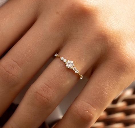 Unique minimalist 14k gold diamond cz engagement ring, Dainty & elegant diamond cz promise ring for her, Unique women gold ring gift for her WE OFFER UNLIMITED PERIOD INSTALLMENTS PLAN This is a beautiful, stunning, feminine ring that works well for all occasions, styles, and ages. You will love it! Ring information: Main stone: White cubic zirconia Approximate size: 4.0mm Accent stones: Cubic zirconia  Approximate size: 1.75mm (6 stones) Approximate width of Band 1.1mm Metal type: Gold Metal stamp: 14k Gold Installment Payments We offer installment payments for an unlimited period for absolutely all products from our store. If you want to change the terms of installments, please contact us. We can propose many different variantions of it. Customization / Replacements Ring can be made with Wedding Ring With Small Diamonds, Gold Diamond Promise Ring, Dainty Engagement Ring Vintage Gold, Engagement Rings Minimalist Gold, Gold Band Promise Ring, Engagement Ring With Small Diamonds, Gold Rings Promise, Vintage Wedding Rings Dainty, Simple Stacked Rings