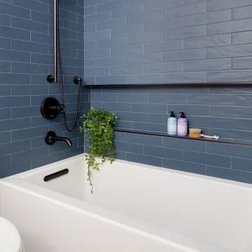 75 Alcove Bathtub with a Niche Ideas You'll Love - July, 2024 | Houzz Beach House Guest Bathroom, Tub Niche, Bathtub Alcove, Beach Style Bathroom, Blue Bathroom Tile, Modern Remodel, Bathtub Tile, Battery Park, Contemporary Light Fixtures