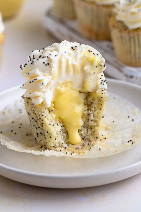 Lemon Poppy Seed Cupcakes with Lemon Curd Filling #lemon #lemoncurd #poppyseed #cupcake #baking #dessert #dessertrecipe | Bakes by Brown Sugar Lemon Poppy Cupcakes, Lemon Filled Cupcakes, Lemon Poppyseed Cupcakes, Poppyseed Cupcakes, Poppy Seed Cupcakes, Lemon Poppy Seed Cupcakes, Lemon Curd Cupcakes, Poppy Seed Filling, Dessert Snacks