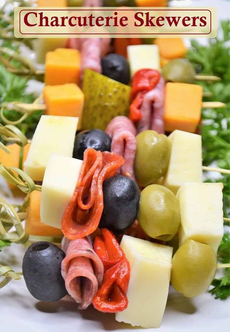 Charcuterie boards are all the rage and these Charcuterie skewers help you serve the meat and cheese your party guests will love with less hassle. Charcuterie on a stick is a fun twist that is simple to prepare and easy to serve and eat. They make a great stand alone appetizer yet pair perfectly with all of your favorite party appetizers. Perfect as a Thanksgiving appetizer, Christmas appetizer, for New Year's Eve or any gathering these appetizer skewers are sure to be a hit. #charcuterie Cheese Meat Skewers, Appetizer Snacks For Party Easy, Bowtie Charcuterie Skewers, New Years Party Appetizers Simple, Meat Cheese Olive Skewer, Cheese Toothpick Appetizers, Classy Party Appetizers, Easy To Make Party Food, Party Food Skewers